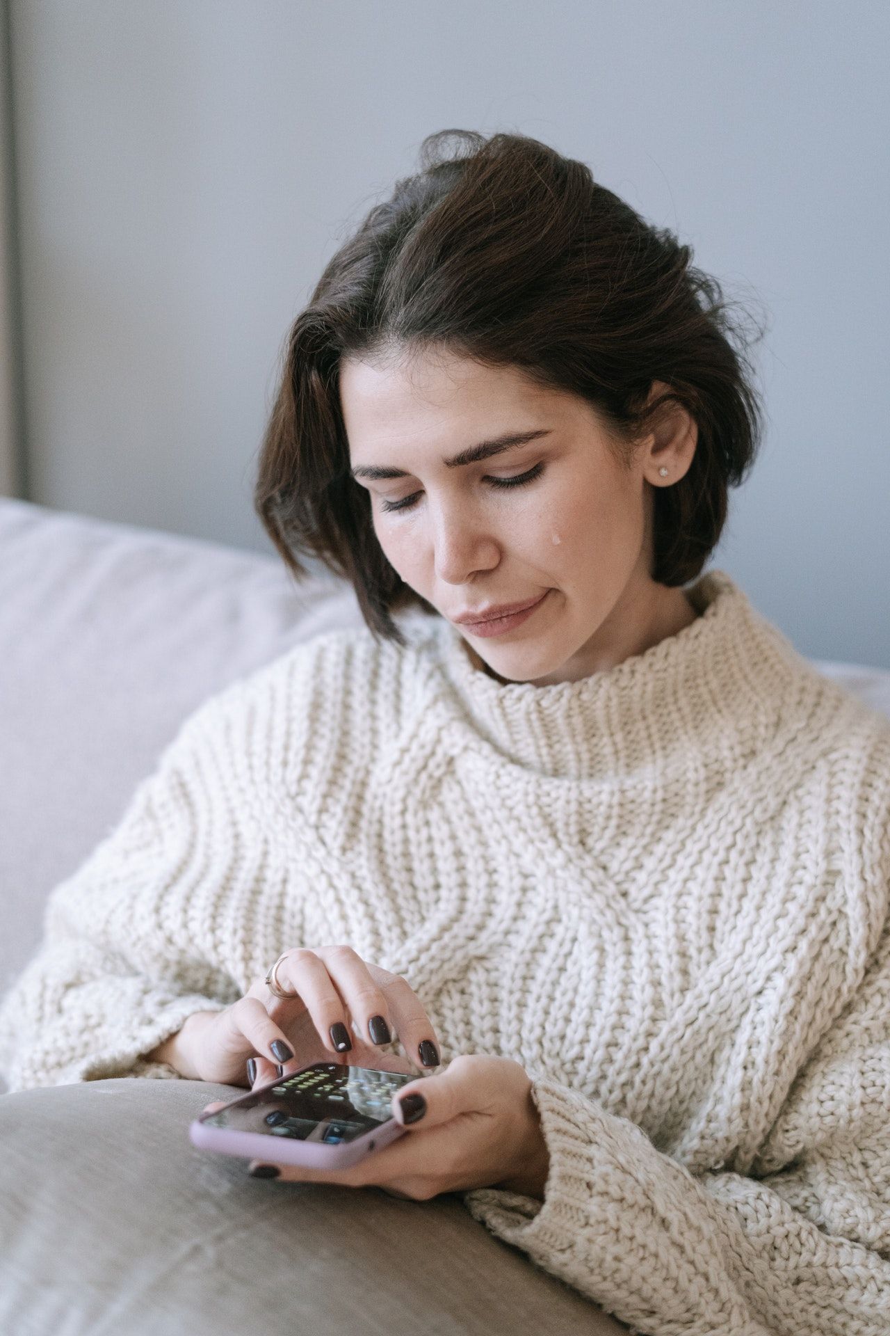 Woman crying reading text