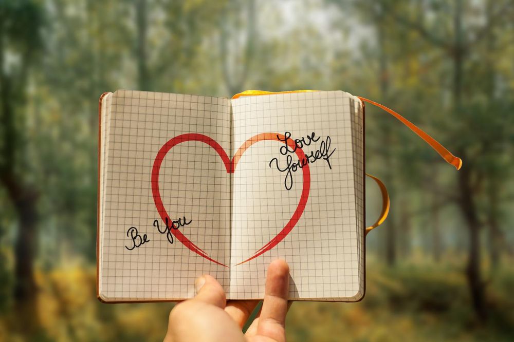 self-love a heart drawn in a notepad